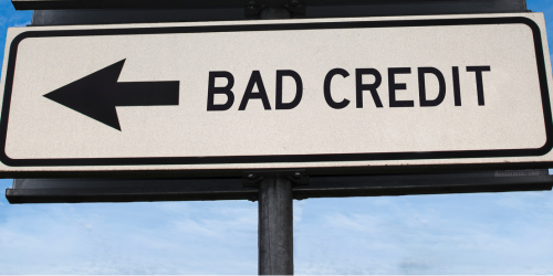 Street sign with an arrow pointing left and the words 'BAD CREDIT,' symbolising financial challenges or poor credit status