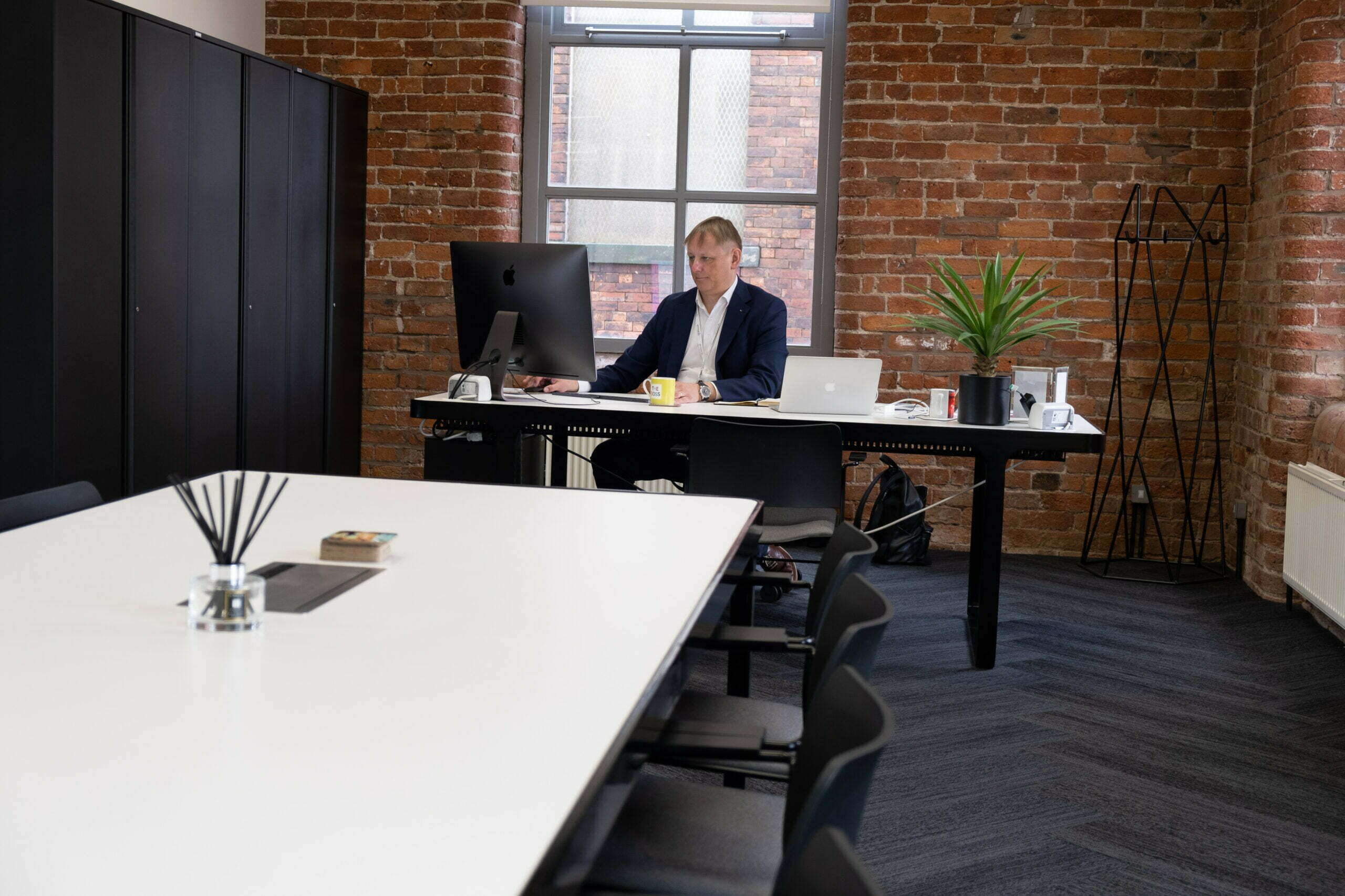 Marsh Finance's CEO sat working at his desk.