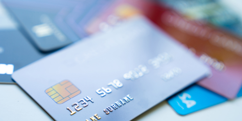 Close-up view of multiple credit and debit cards fanned out, representing financial tools and payment options.