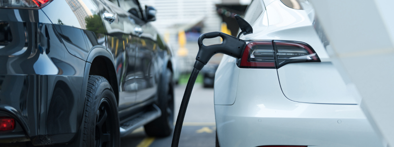 A close up of an electric car charging.