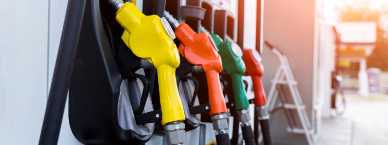 A row of multi-coloured petrol pumps.