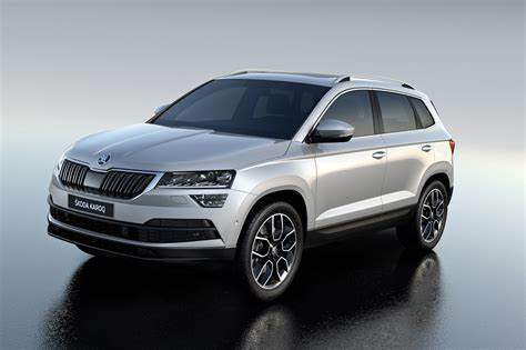 A grey Skoda Karoq against a plain background.