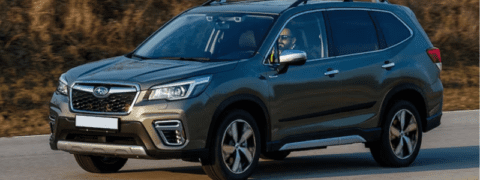 A Subaru Forester driving on a road.