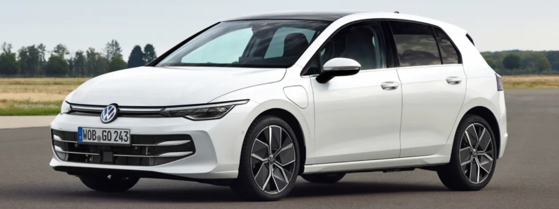 A white VW Golf parked on a an open track.