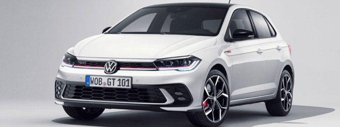 A white VW Polo parked up against a grey blank background.