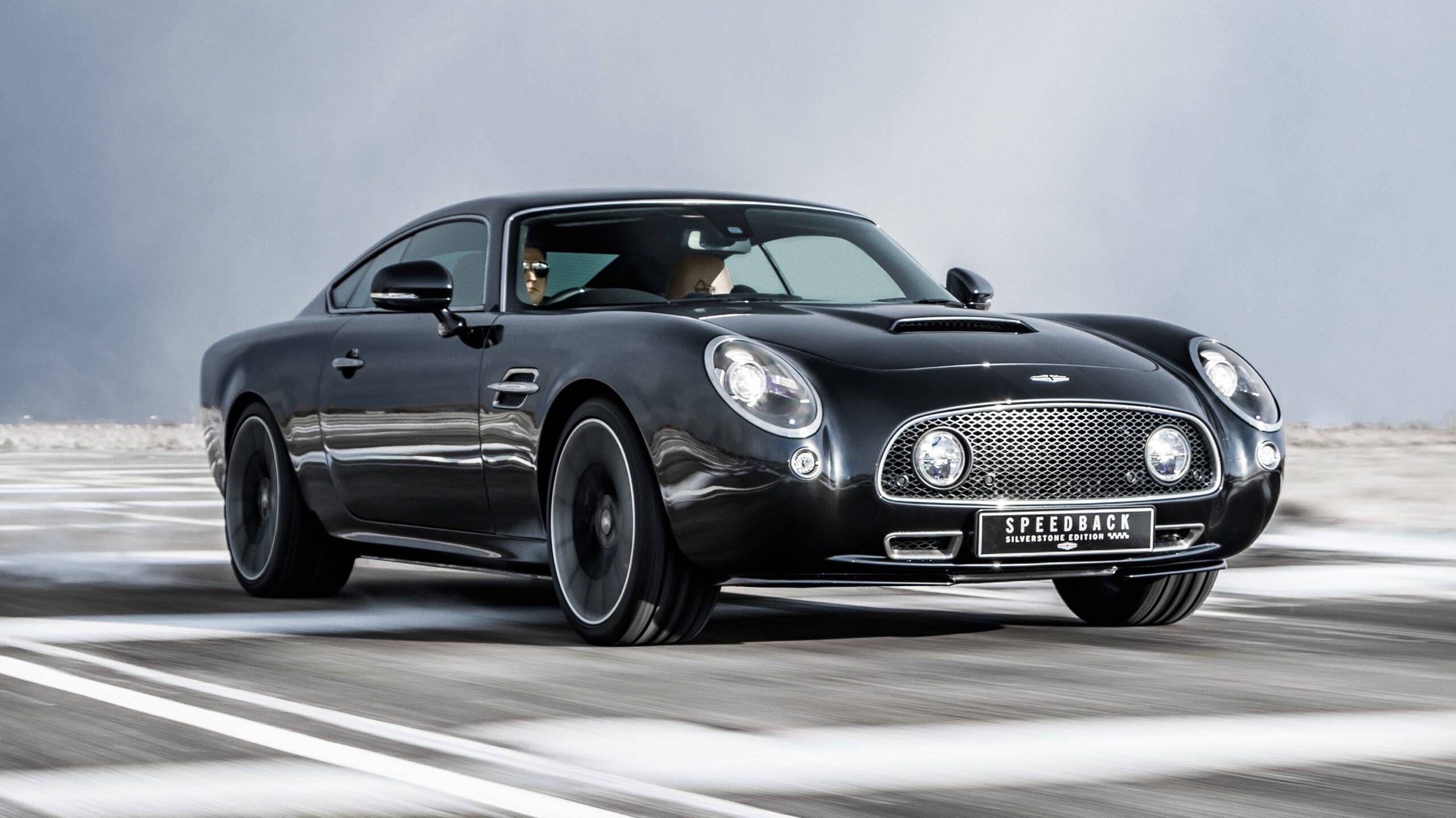 The David Brown Automotive Speedback GT in black driving.