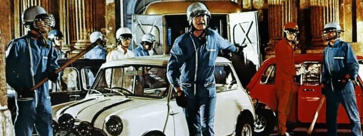 An image taken from the Italian Job film showing classic Mini Coopers in the background.