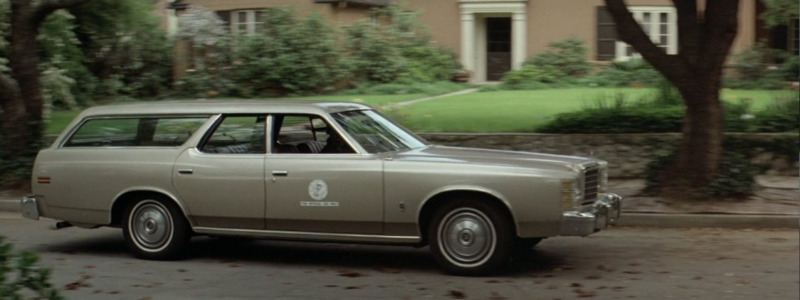 The car from the Halloween film in 1978, driving in a residential area.