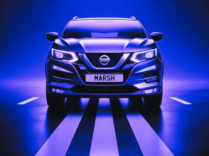 A Nissan Qashqai against a light purple and blue glow.