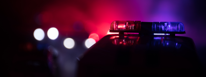 A close up of police car lights at night.