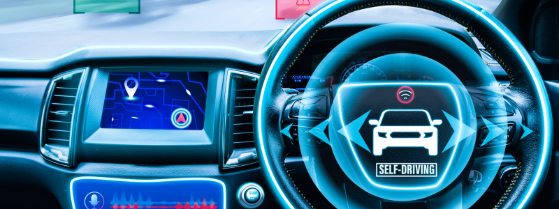 Futuristic car dashboard showcasing self-driving technology with digital interface.