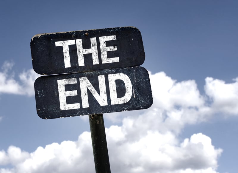 The End sign with clouds and sky background