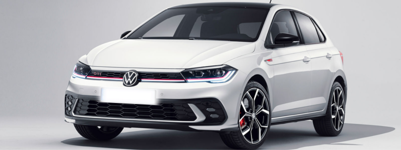 A white VW Polo parked against a blank background, likely in a car showroom.