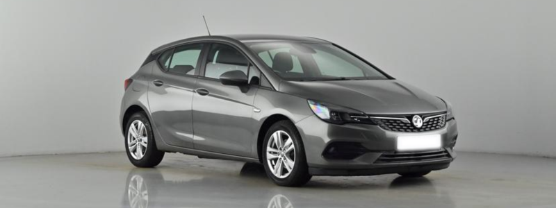 A grey Vauxhall Astra parked against a grey background, likely in a car showroom.